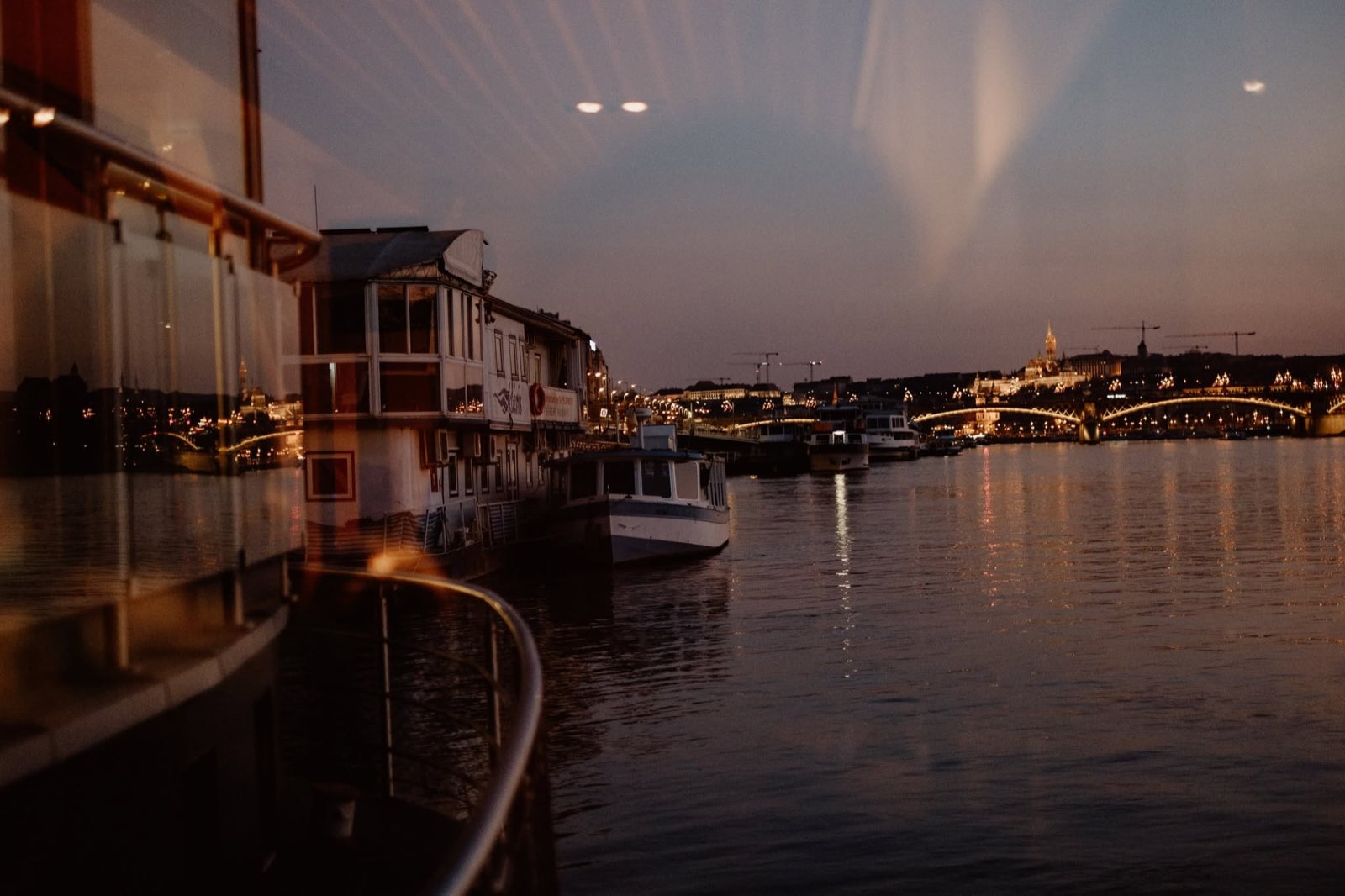 The Danube at dusk beside the boat, with Margaret Bridge and Buda Castle
