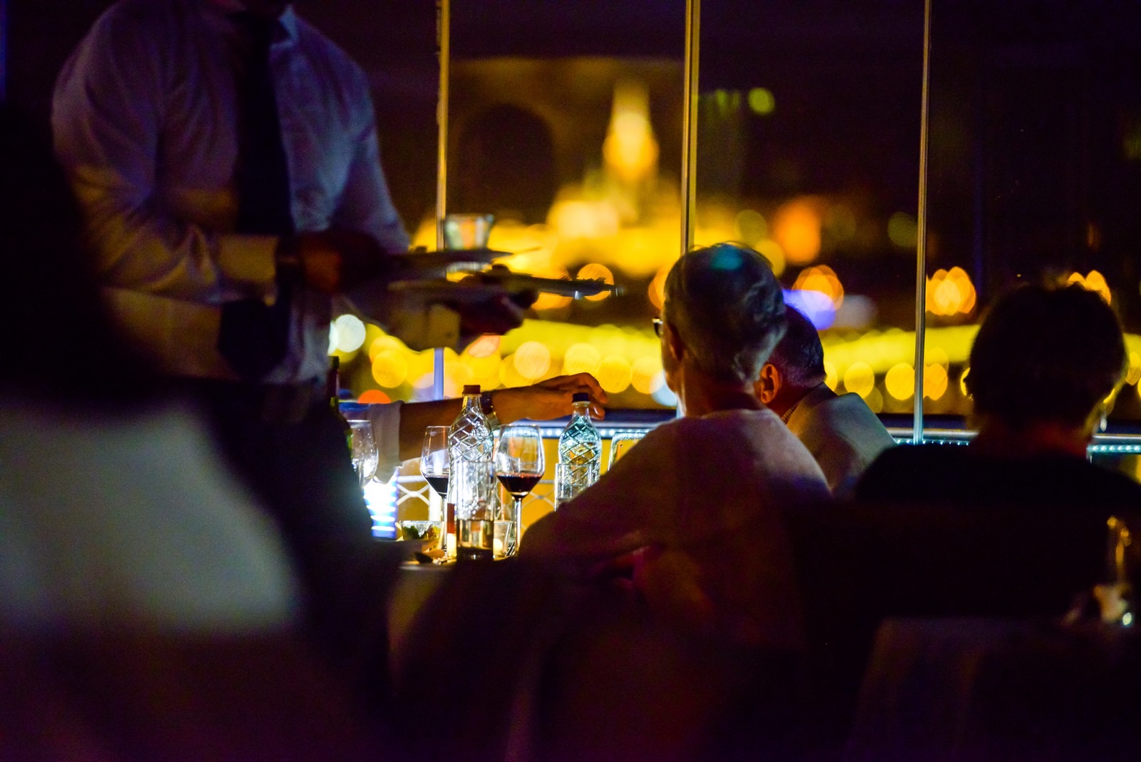 Evening service, the lights of Buda Castle behind
